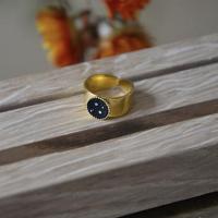 Grosse bague noir petillant 
